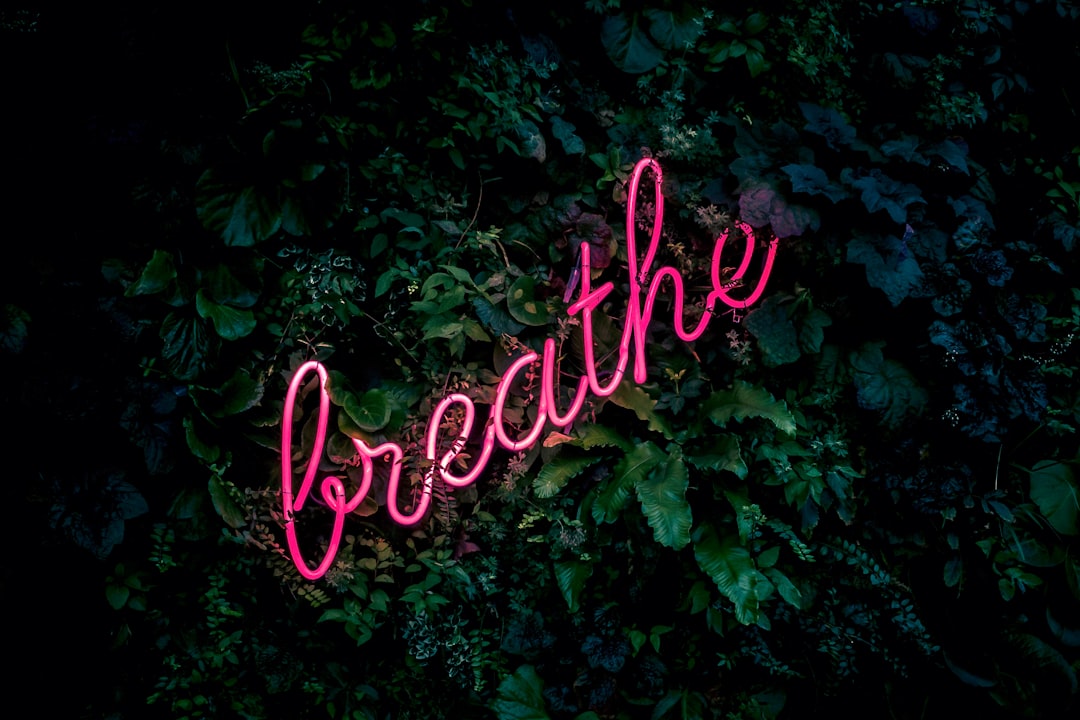 Breathe Amsterdam, @ Kimpton De Witt Amsterdam by Surf Brands pink breathe neon sign